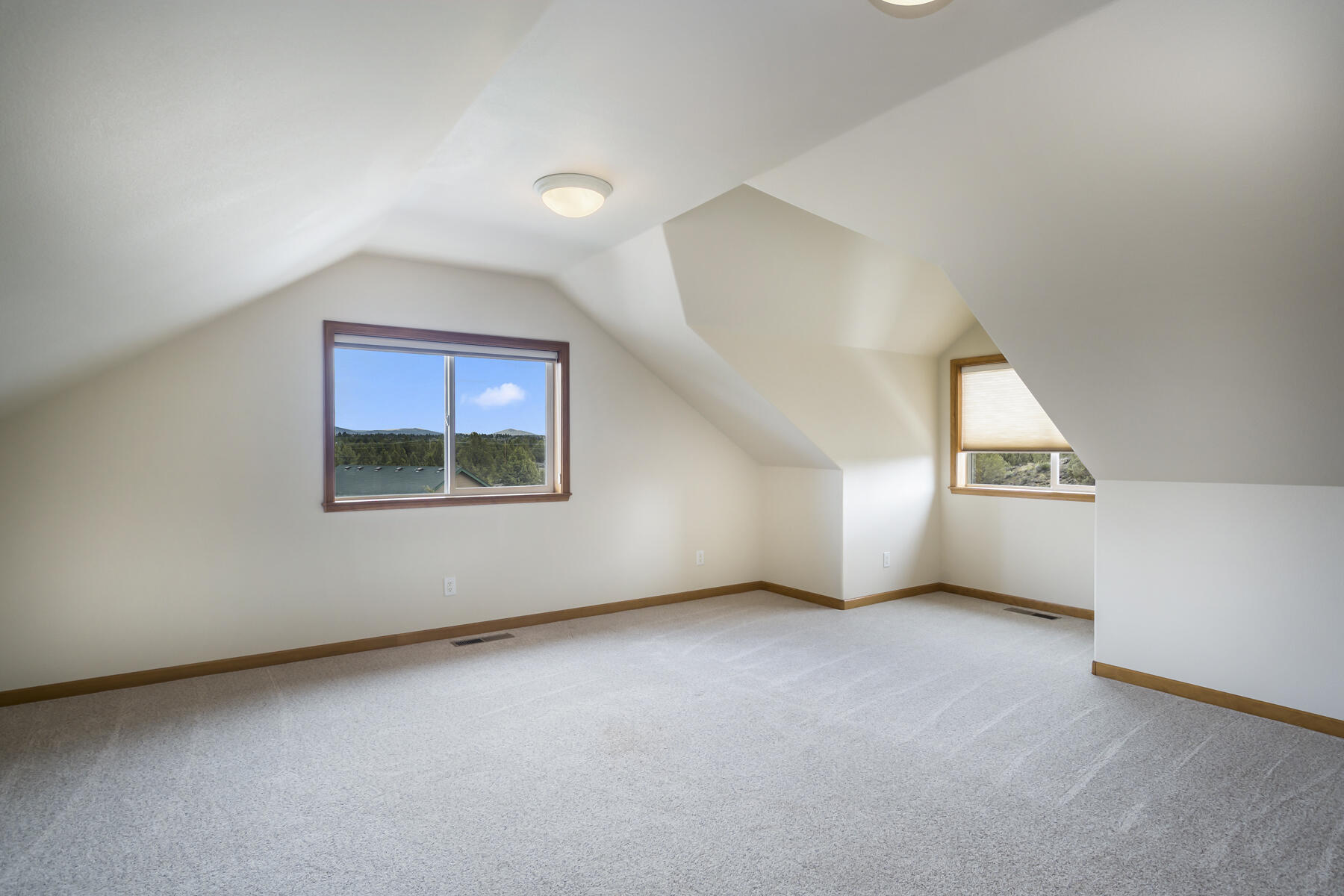 60850 Jennings Road Bend, OR 97702 - Photo 37 of 52 an empty room with a empty space and windows