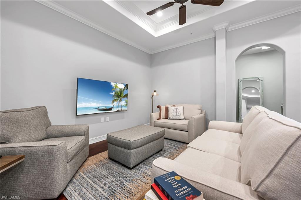 4819 West Blvd Court, Unit 103 Naples, FL 34103 - Photo 14 of 19 a living room with furniture