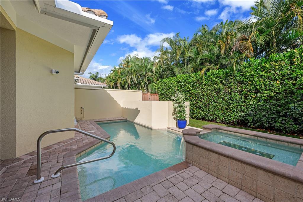 4819 West Blvd Court, Unit 103 Naples, FL 34103 - Photo 18 of 19 a view of a backyard