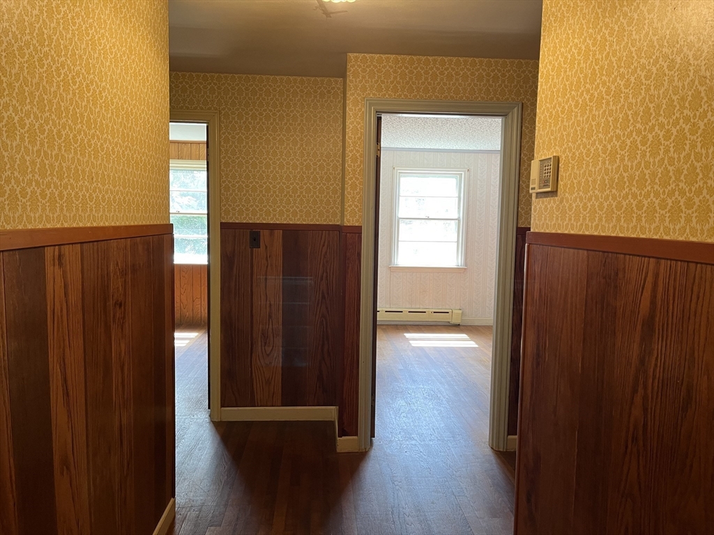 10 Renfrew Street Worcester, MA 01604 - Photo 14 of 25 a view of a hallway with wooden floor