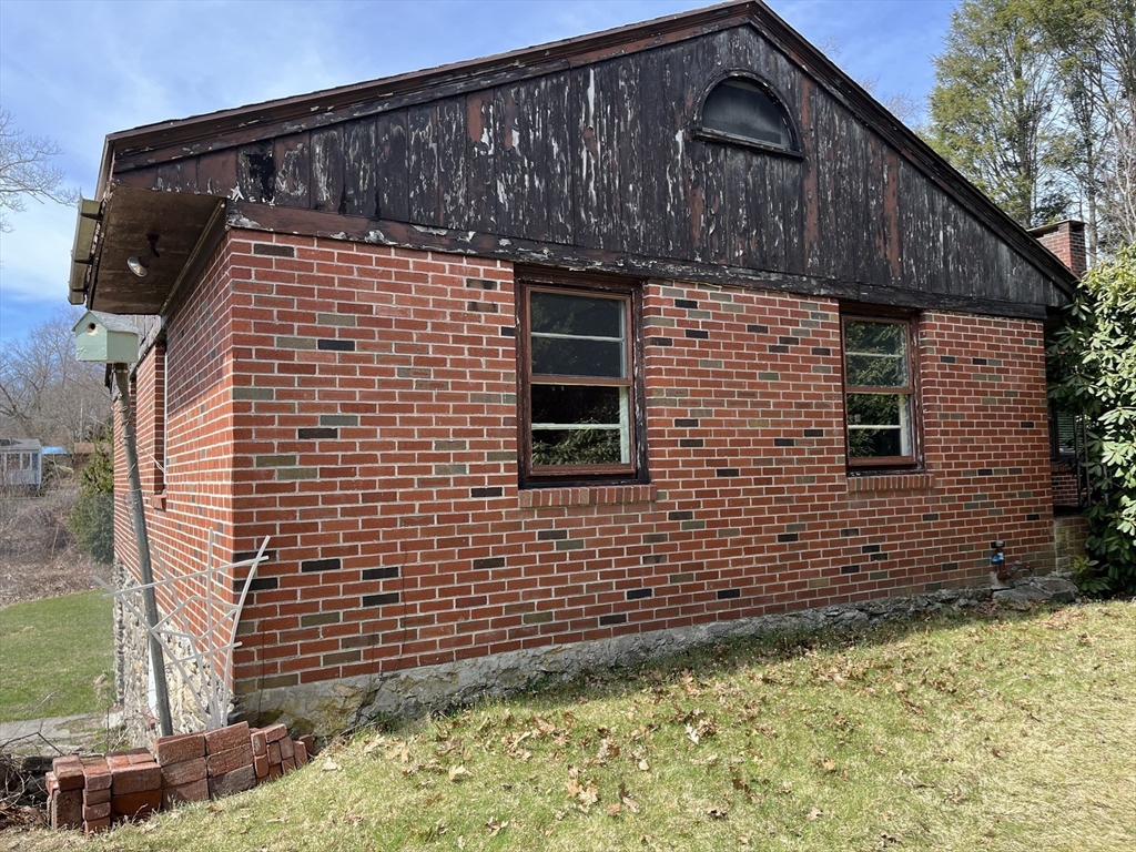 10 Renfrew Street Worcester, MA 01604 - Photo 15 of 25 a front view of a house with a yard