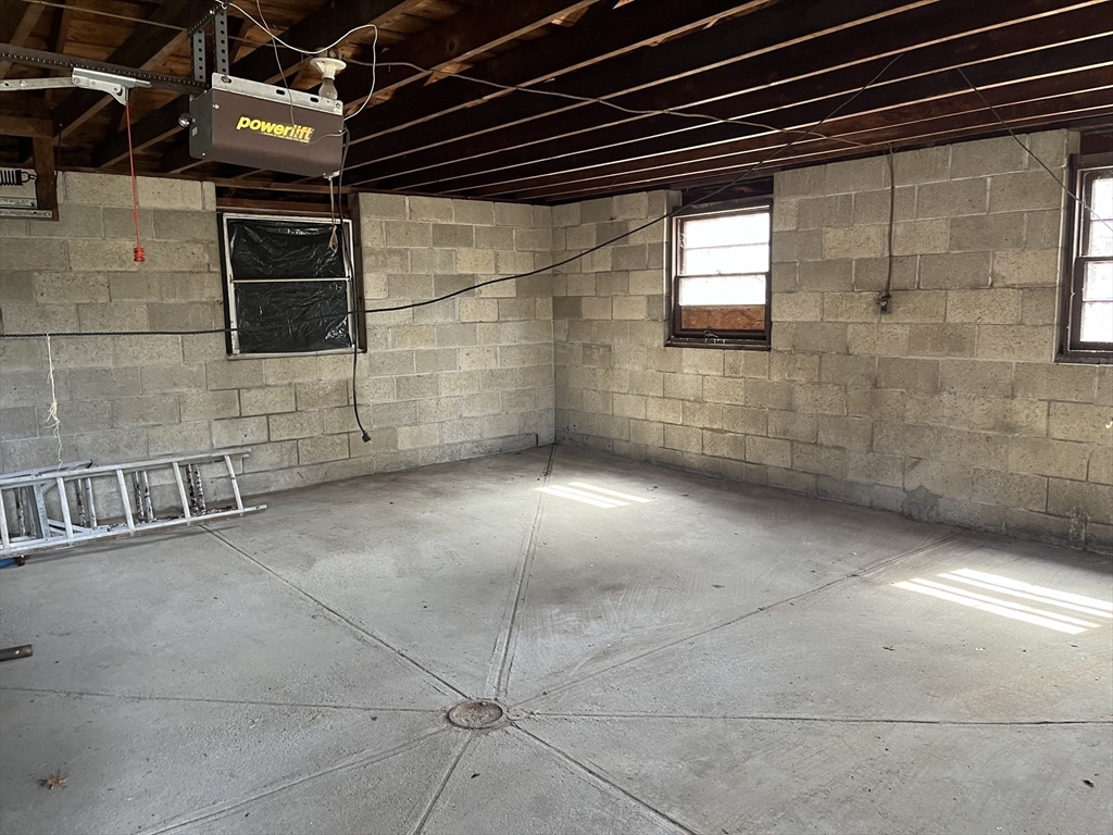 10 Renfrew Street Worcester, MA 01604 - Photo 18 of 25 a view of a garage room with washing machine