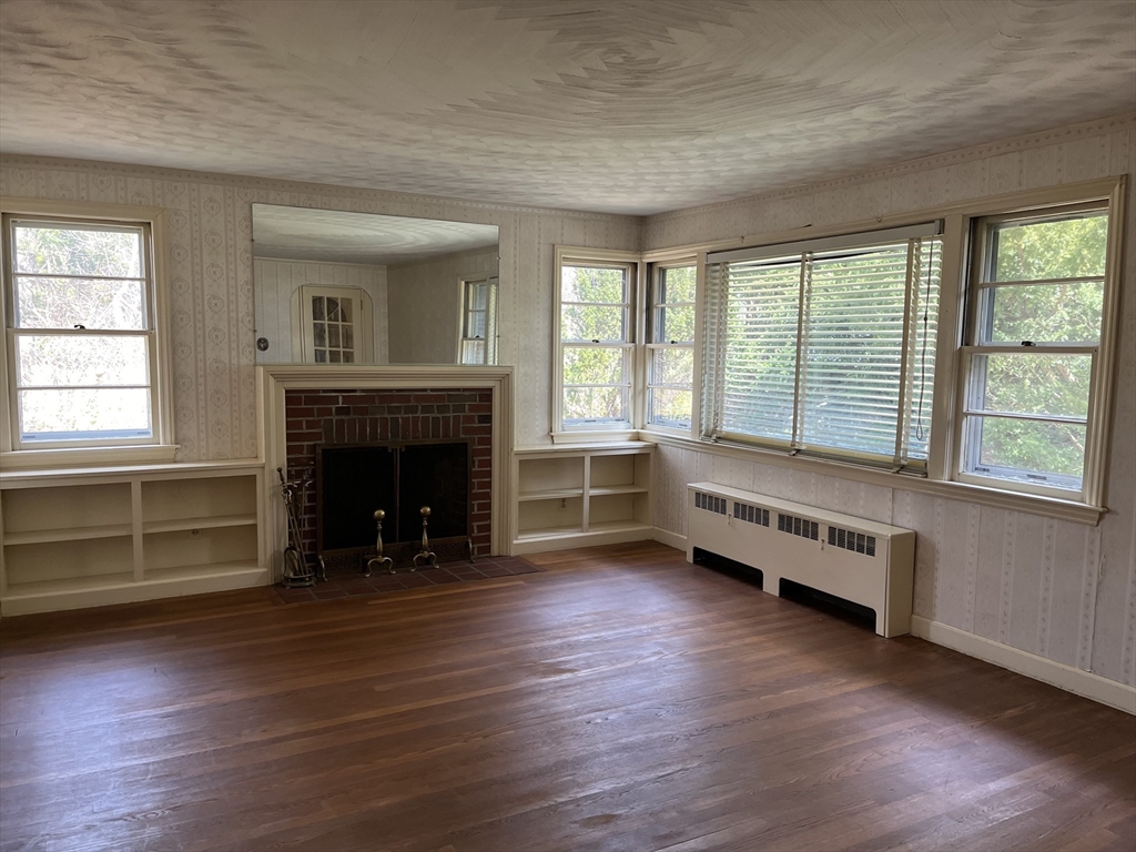 10 Renfrew Street Worcester, MA 01604 - Photo 2 of 25 a living room with furniture and a fireplace