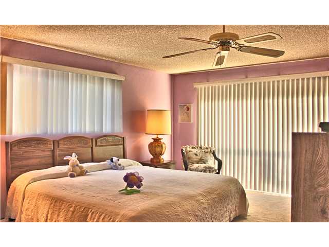 2426 Windmill View Road El Cajon, CA 92020 - Photo 14 of 23 Large master bedroom with sliders to the balcony - perfect place for morning coffee and watching the sun set!