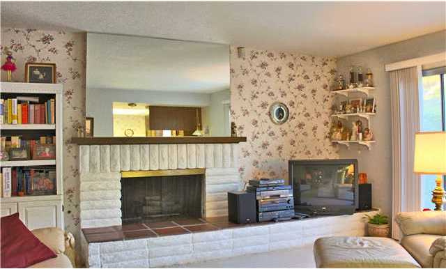 2426 Windmill View Road El Cajon, CA 92020 - Photo 4 of 23 Cozy family room with fireplace - adjacent to the kitchen and opens to the back patio.