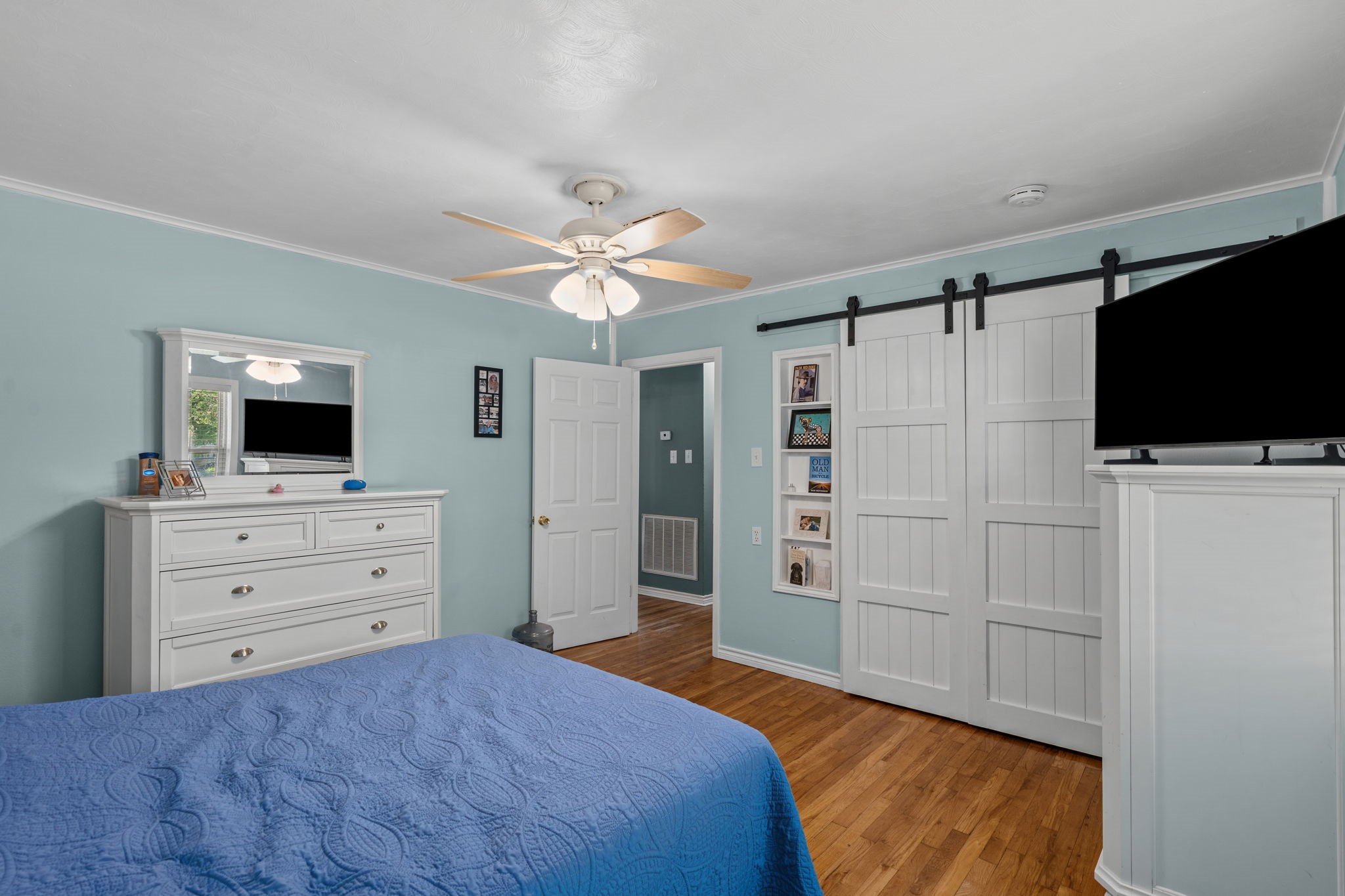 4630 Hudson Road Santa Fe, TX 77517 - Photo 27 of 44 a bedroom with a bed and a flat screen tv