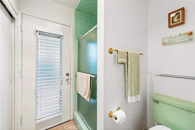 a view of living room with furniture and a window