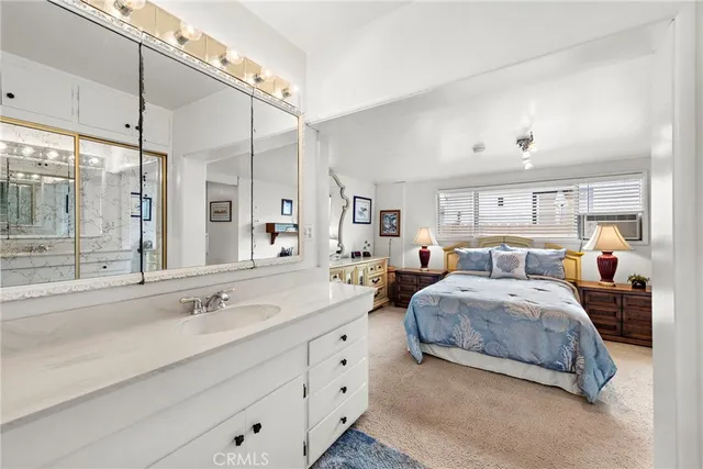 a spacious bedroom with double bed and a large mirror