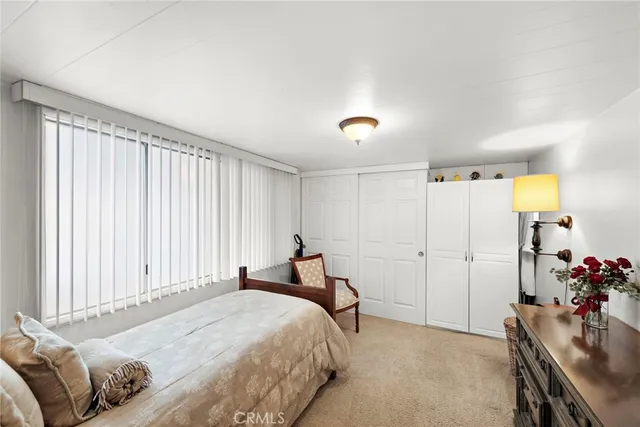 a bed room with a bed and a couch