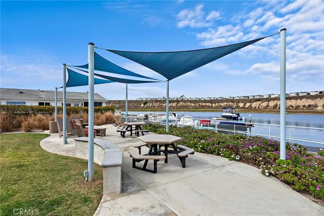 a view of a patio with chairs and a table