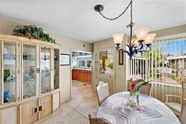 a bedroom with furniture a bed and a chandelier