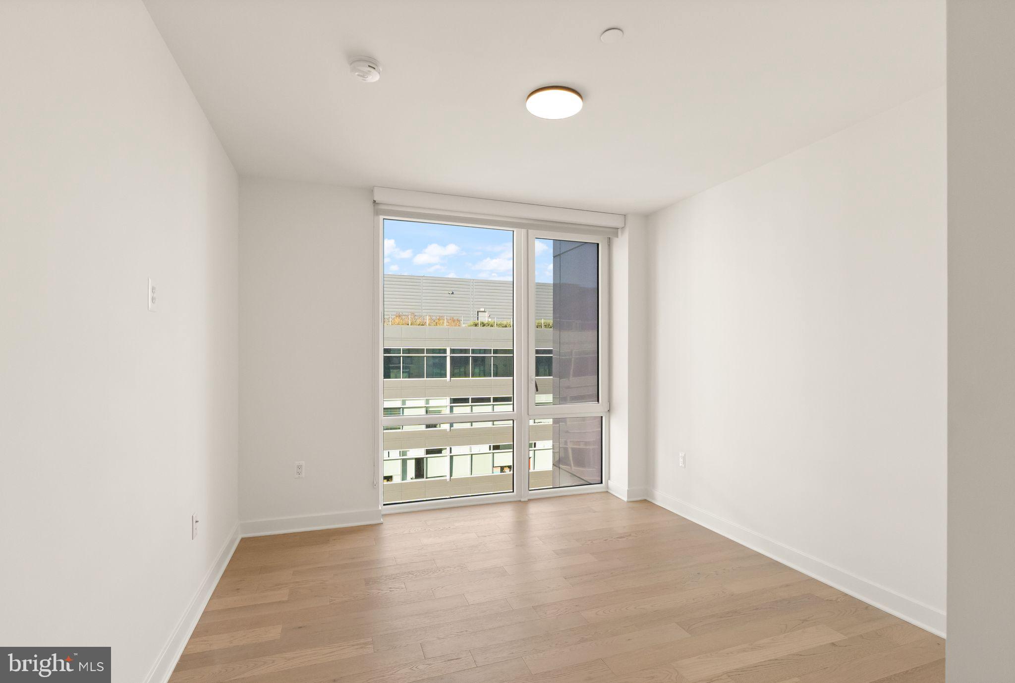 37 L Street Southeast, Unit 1102 Washington, DC 20003 - Photo 16 of 38 an empty room with window