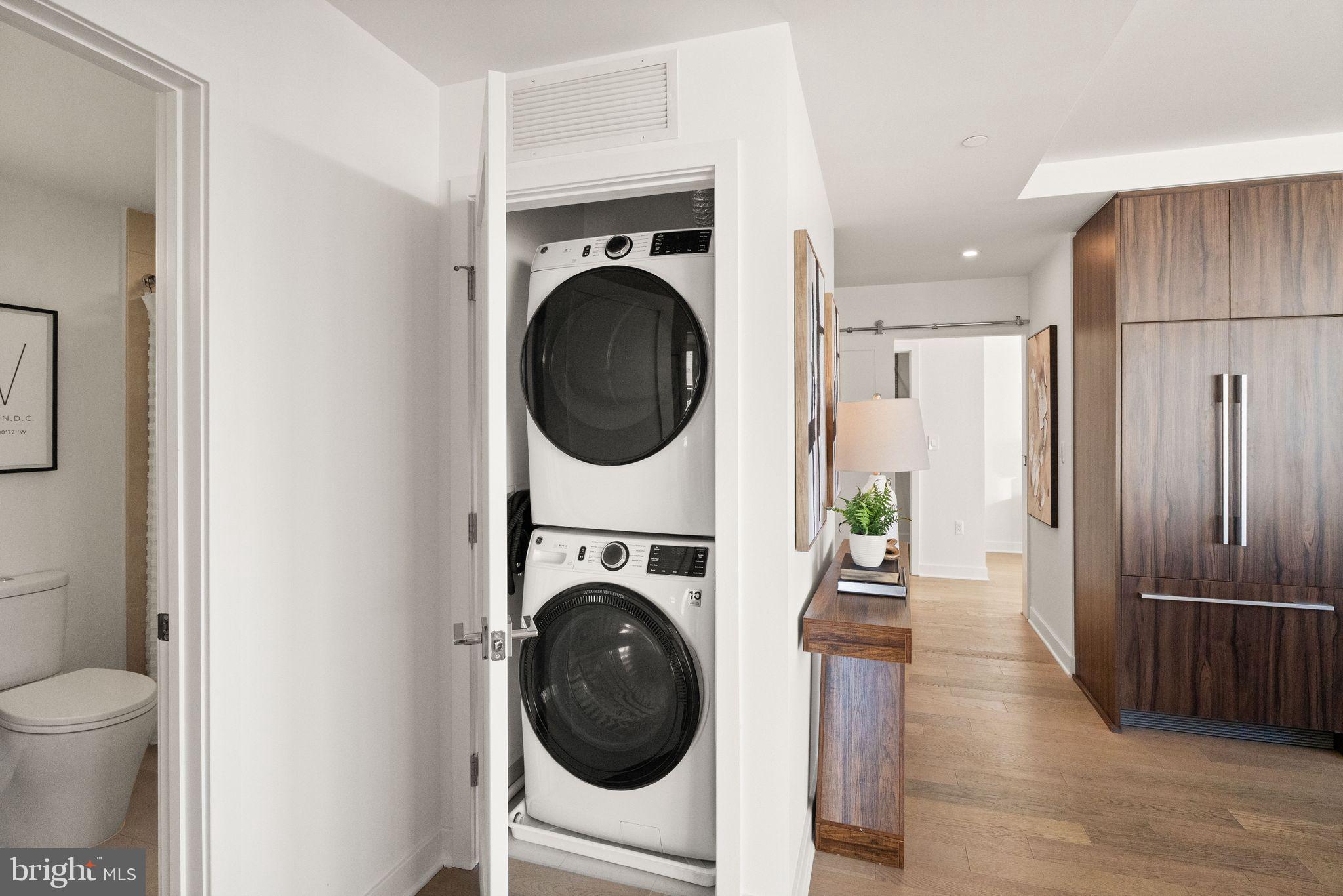 37 L Street Southeast, Unit 1102 Washington, DC 20003 - Photo 20 of 38 a view of a hallway with washer and dryer