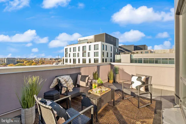 a view of a chairs and table in patio