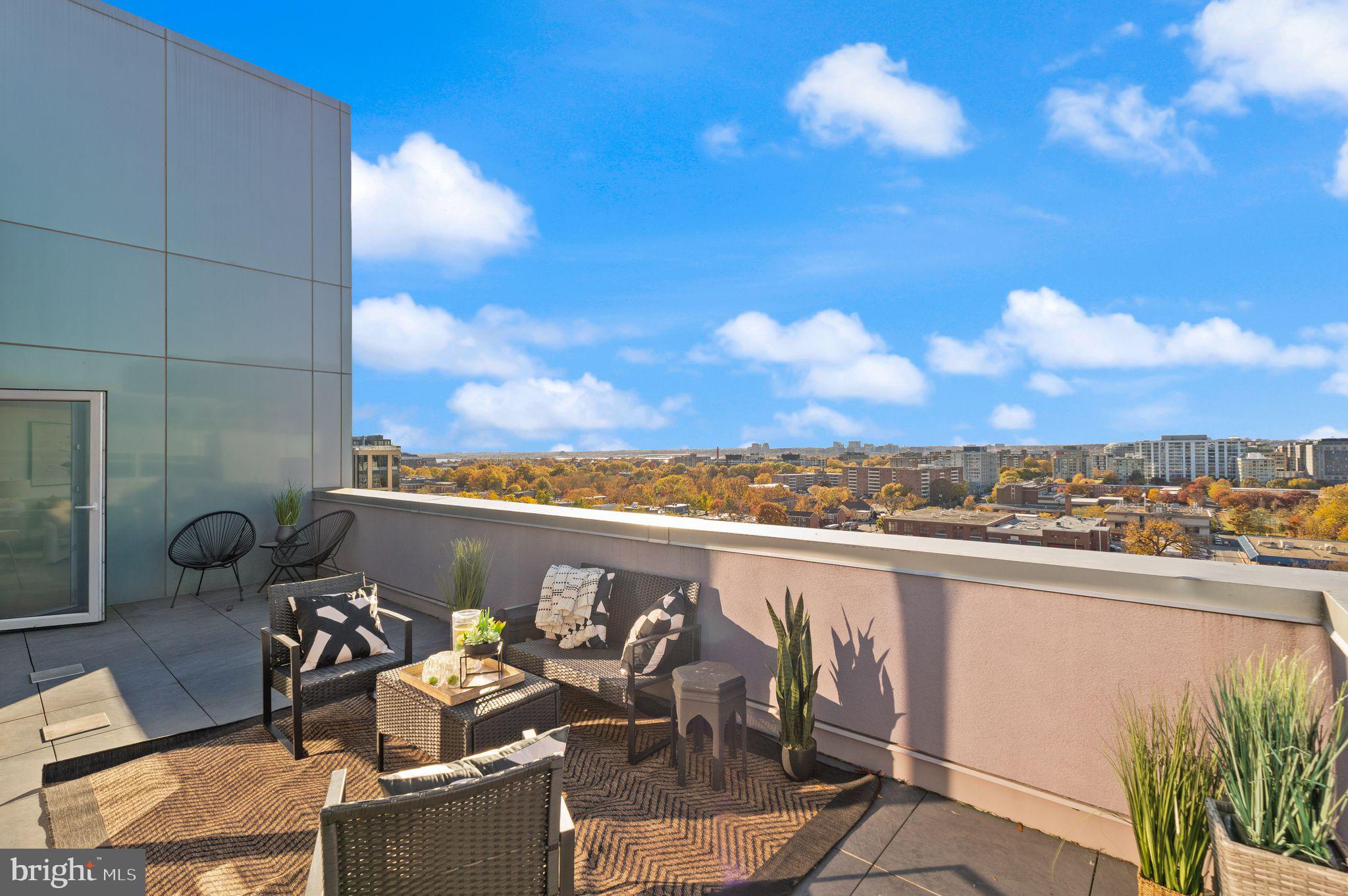 37 L Street Southeast, Unit 1102 Washington, DC 20003 - Photo 23 of 38 a view of a terrace with furniture and a potted plant