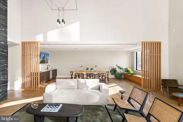 a living room with furniture and a table