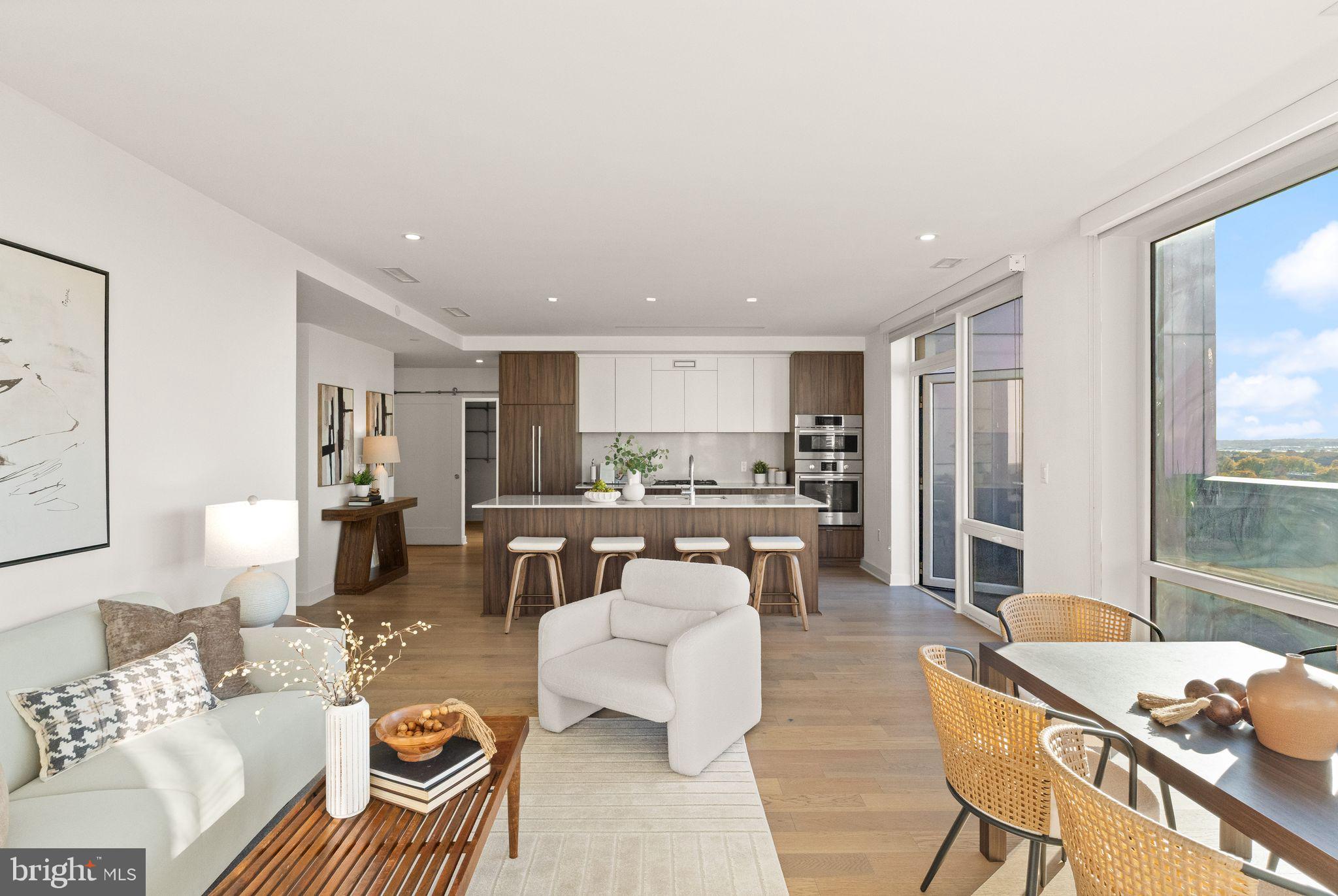 37 L Street Southeast, Unit 1102 Washington, DC 20003 - Photo 4 of 38 a living room with furniture and a table
