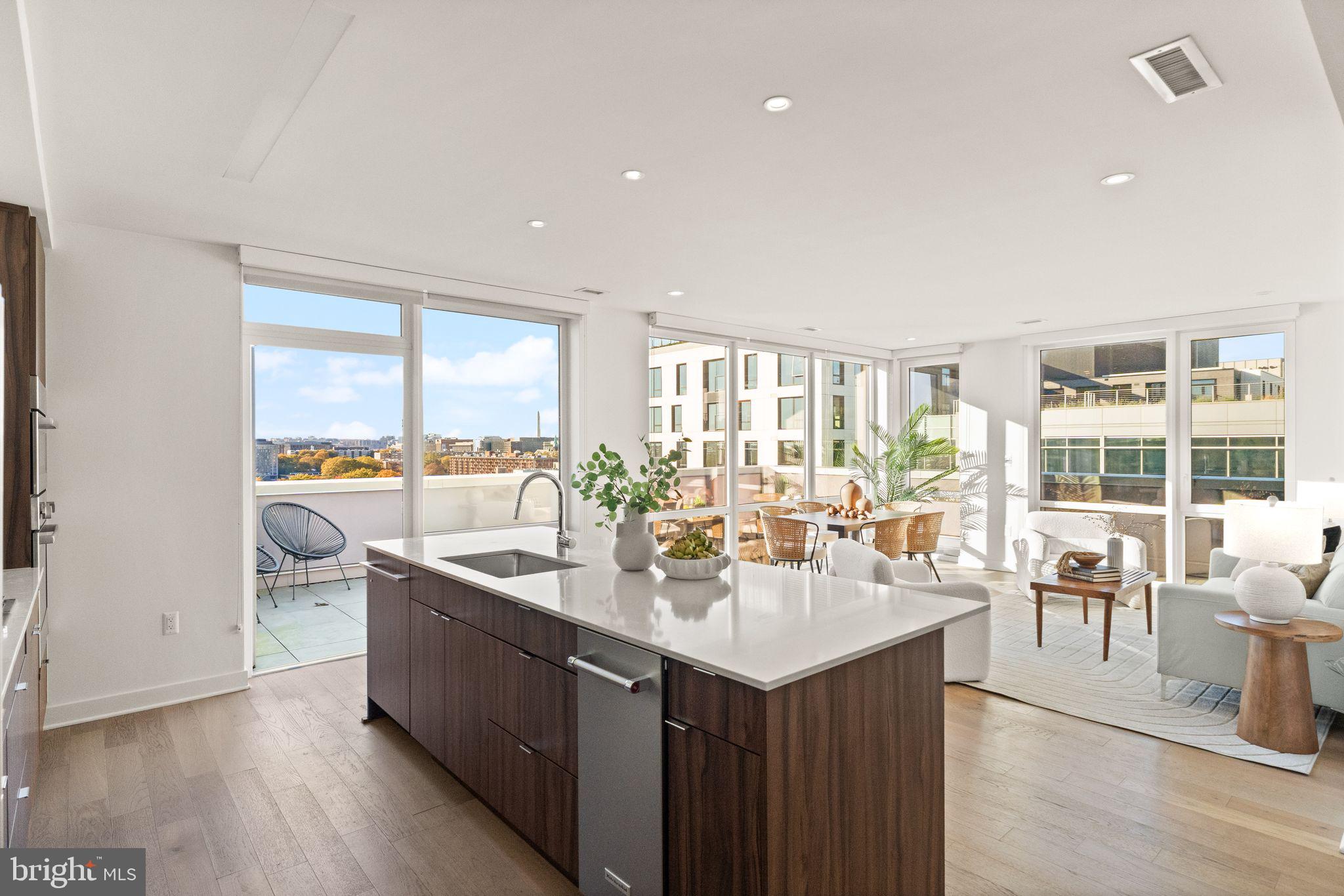 37 L Street Southeast, Unit 1102 Washington, DC 20003 - Photo 8 of 38 a kitchen with a sink and a large window