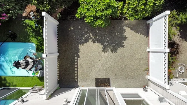 a view of a house with a backyard