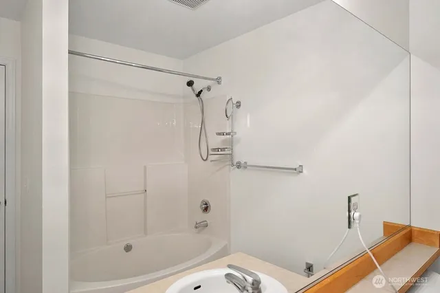 a bathroom with a bath tub