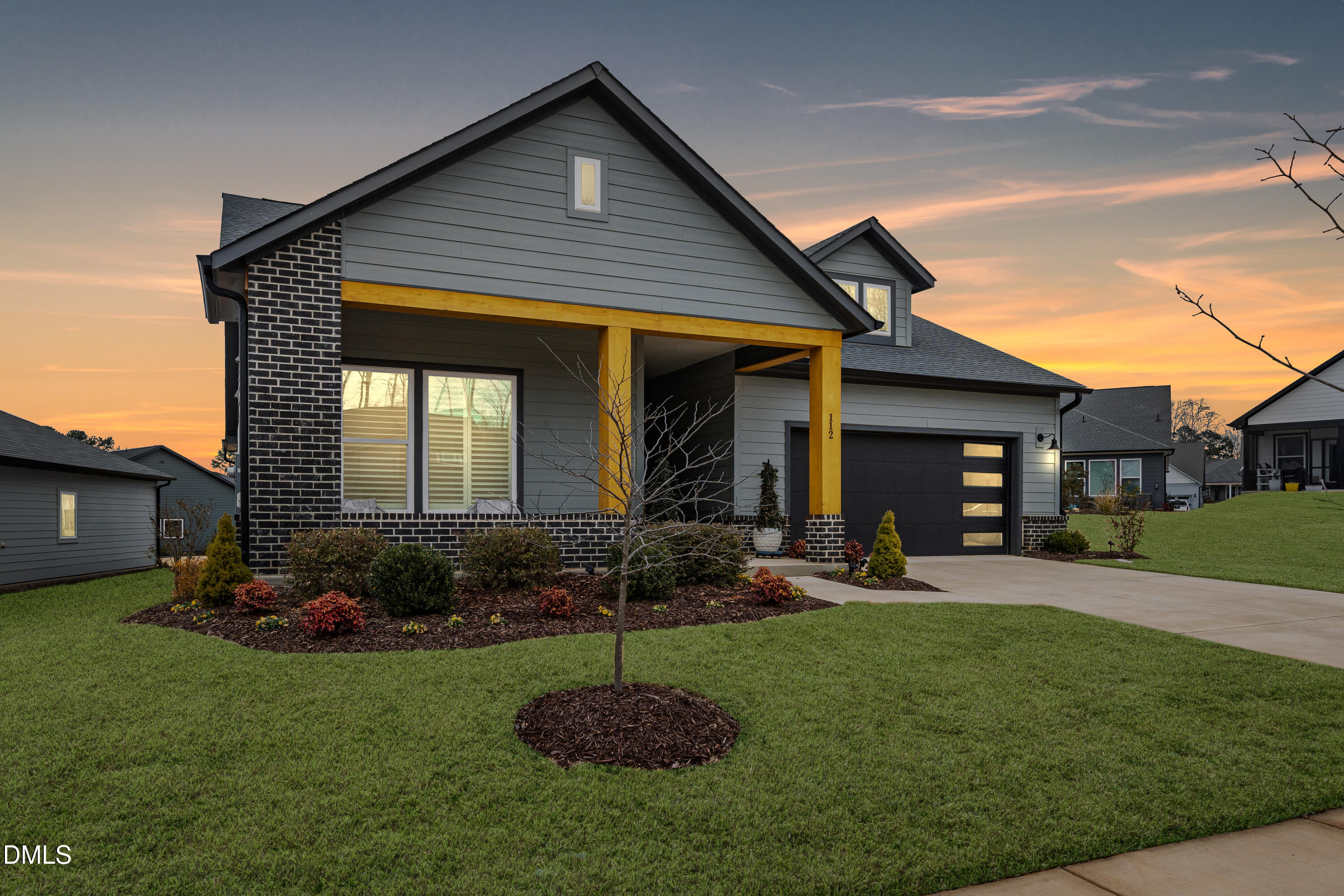 112 Imagine Way Pittsboro, NC 27312 - Photo 39 of 43 a front view of a house with garden