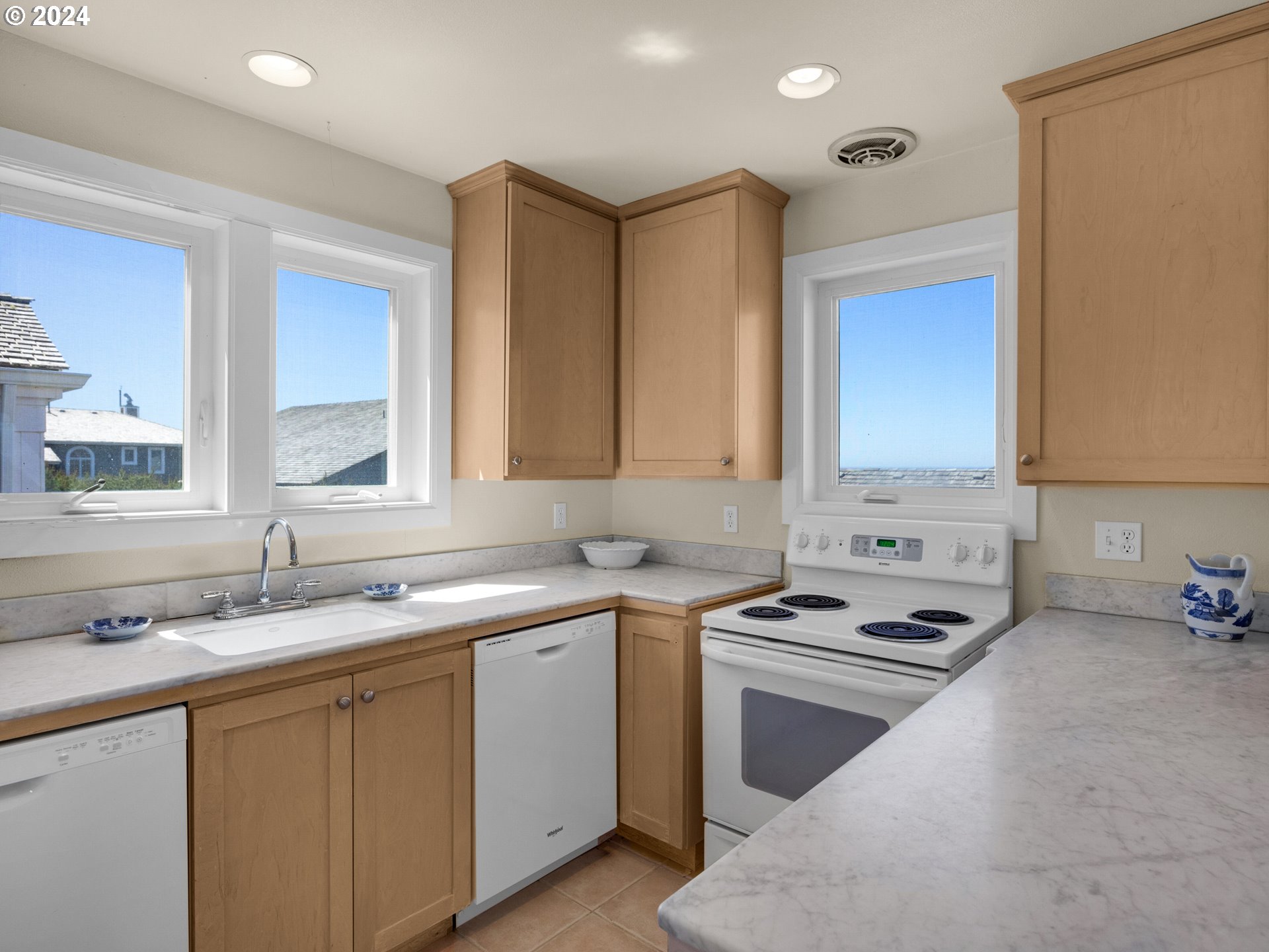 5290 High Ridge Road Gearhart, OR 97138 - Photo 10 of 26 a kitchen that has a sink and a stove