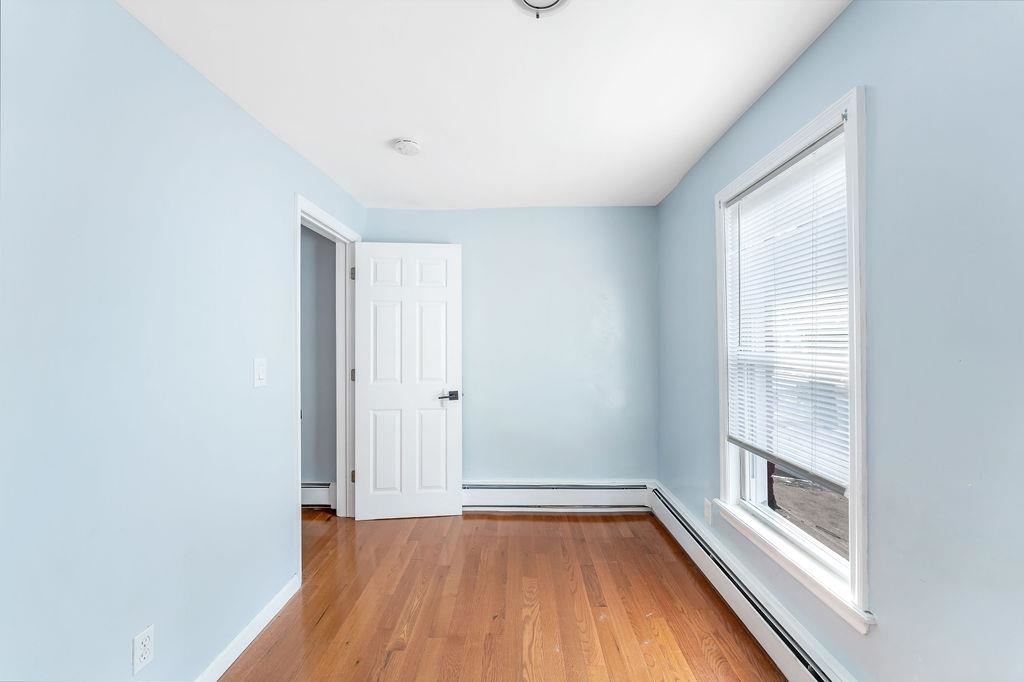 693 Chestnut Street, Unit 2 Kearny, NJ 07032 - Photo 16 of 19 a view of room with window and wooden floor
