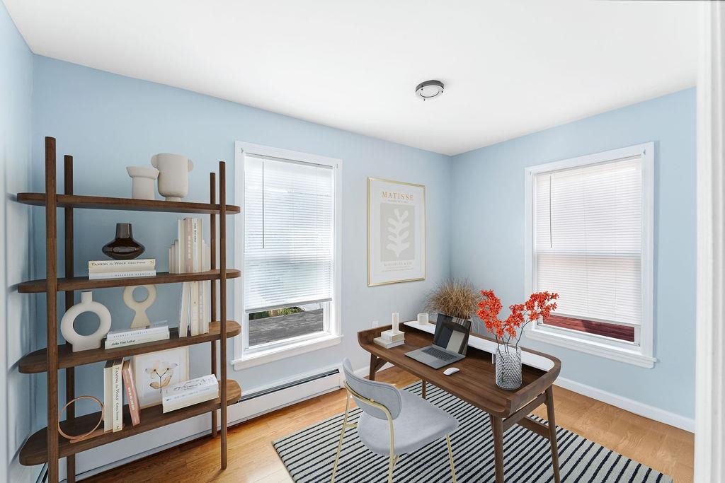 693 Chestnut Street, Unit 2 Kearny, NJ 07032 - Photo 5 of 19 a living room with furniture a rug and a window