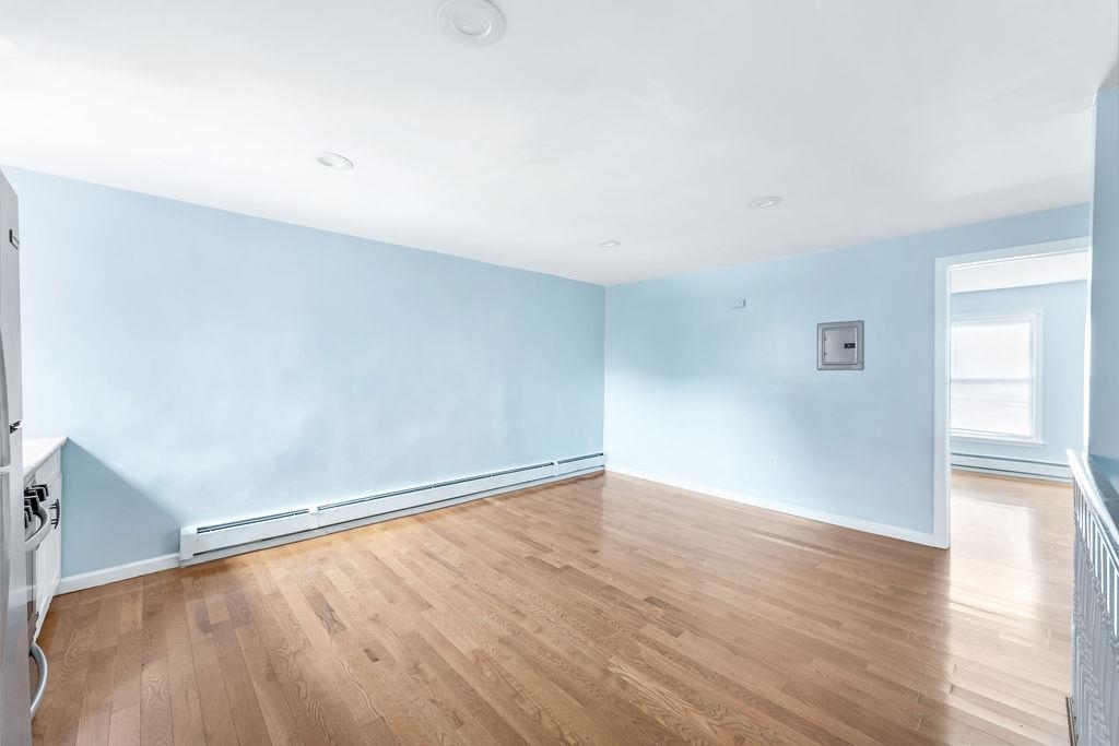 693 Chestnut Street, Unit 2 Kearny, NJ 07032 - Photo 9 of 19 a view of an empty room with wooden floor