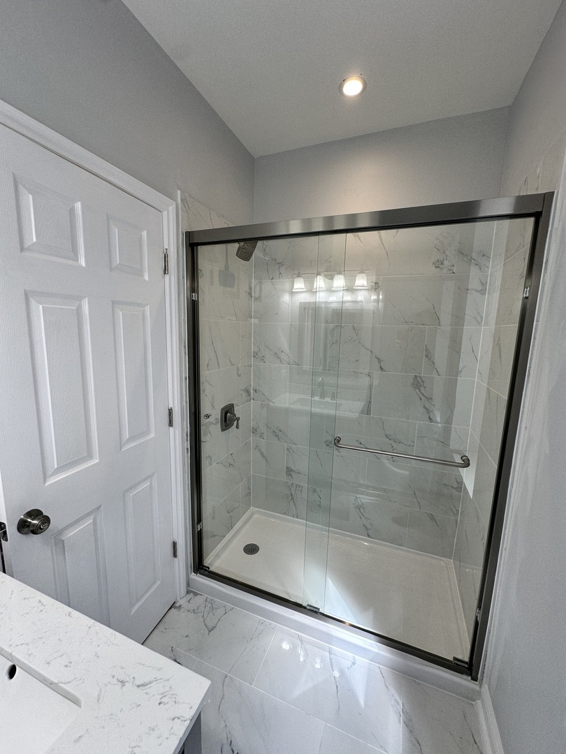 2002 West 21st Place, Unit GDN Chicago, IL 60608 - Photo 6 of 9 a bathroom with a shower and a sink