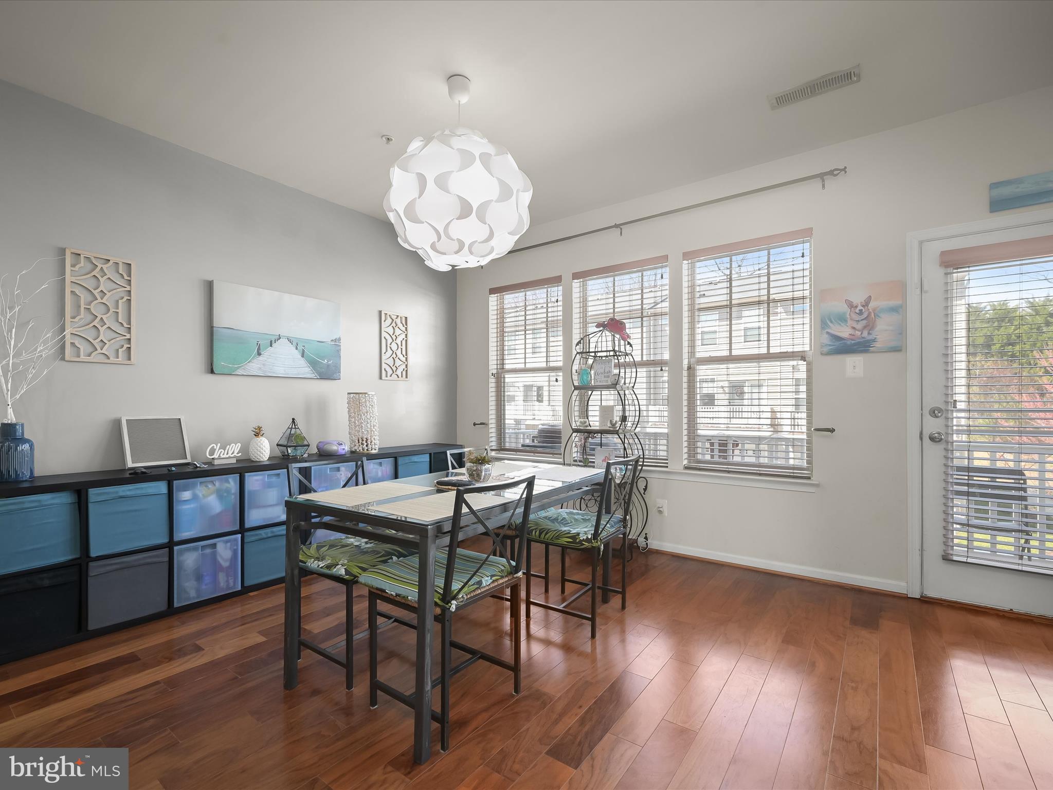 1117 Red Hawk Way Severn, MD 21144 - Photo 11 of 39 a view of a dining room with furniture wooden floor and chandelier