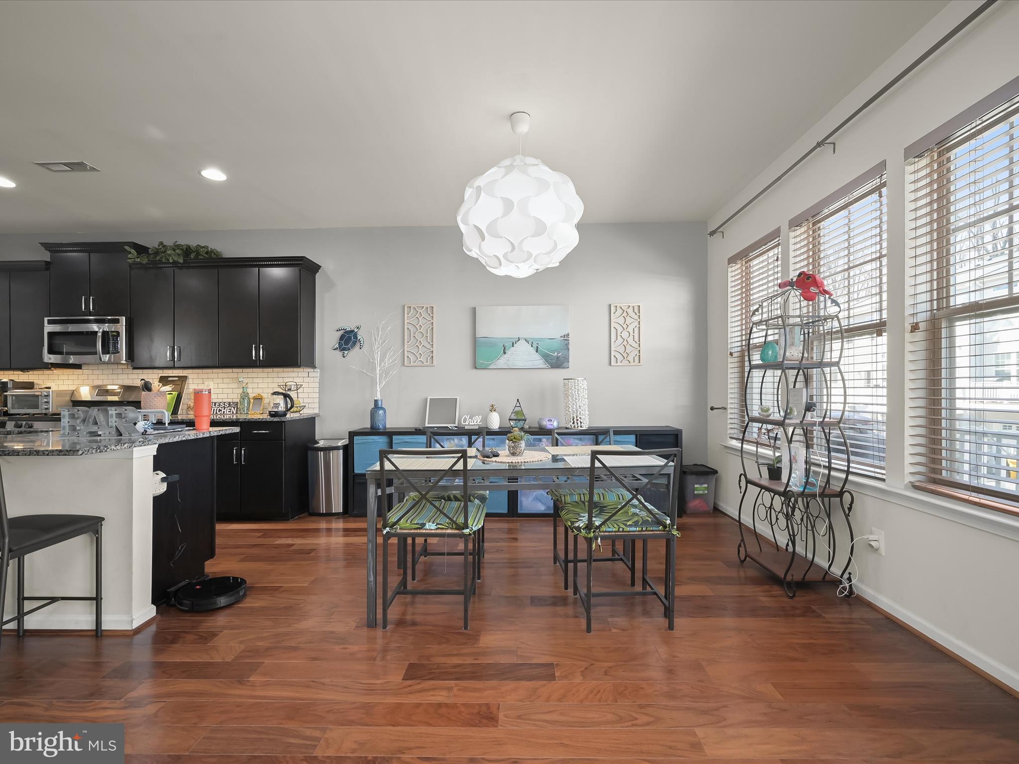 1117 Red Hawk Way Severn, MD 21144 - Photo 12 of 39 a view of a dining room with furniture window and wooden floor