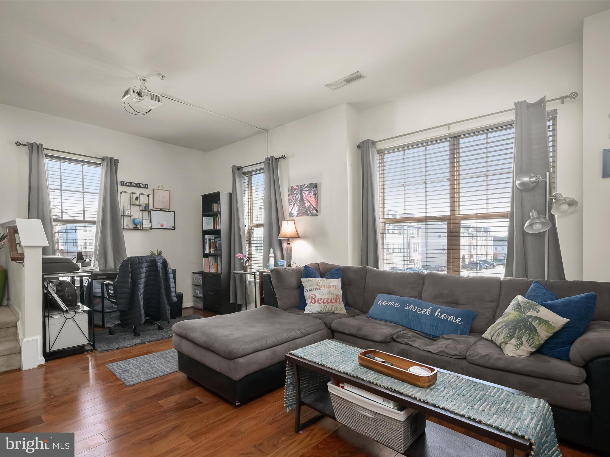 1117 Red Hawk Way Severn, MD 21144 - Photo 24 of 39 a living room with furniture and wooden floor