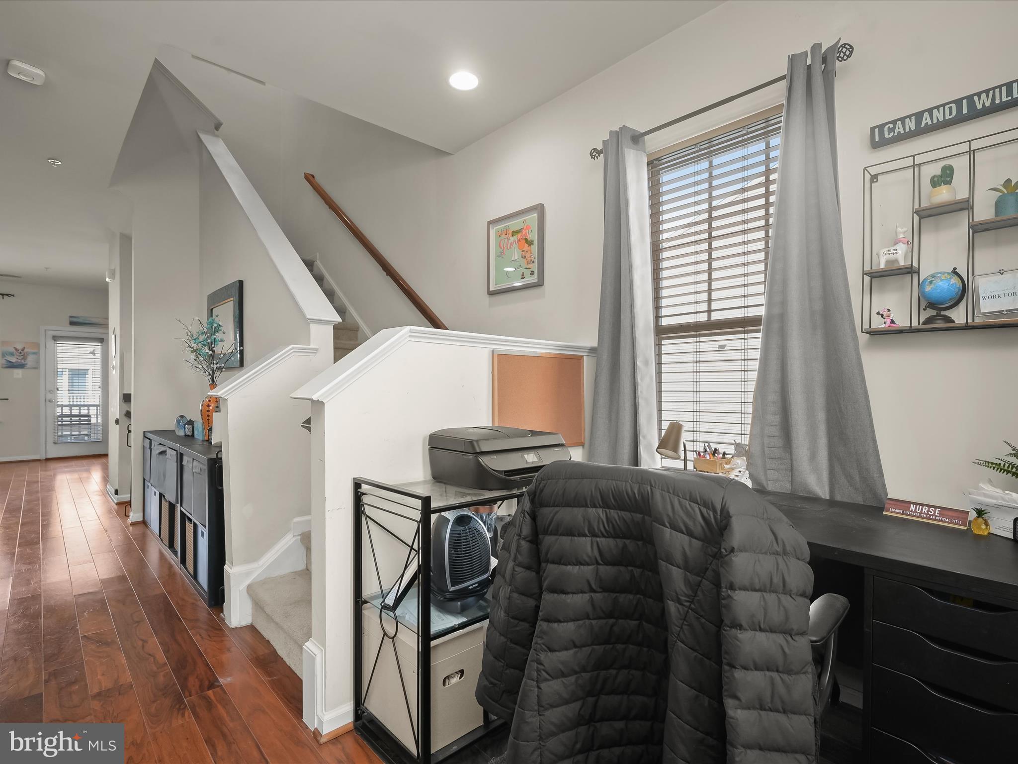 1117 Red Hawk Way Severn, MD 21144 - Photo 27 of 39 a living room with furniture a flat screen tv and a window