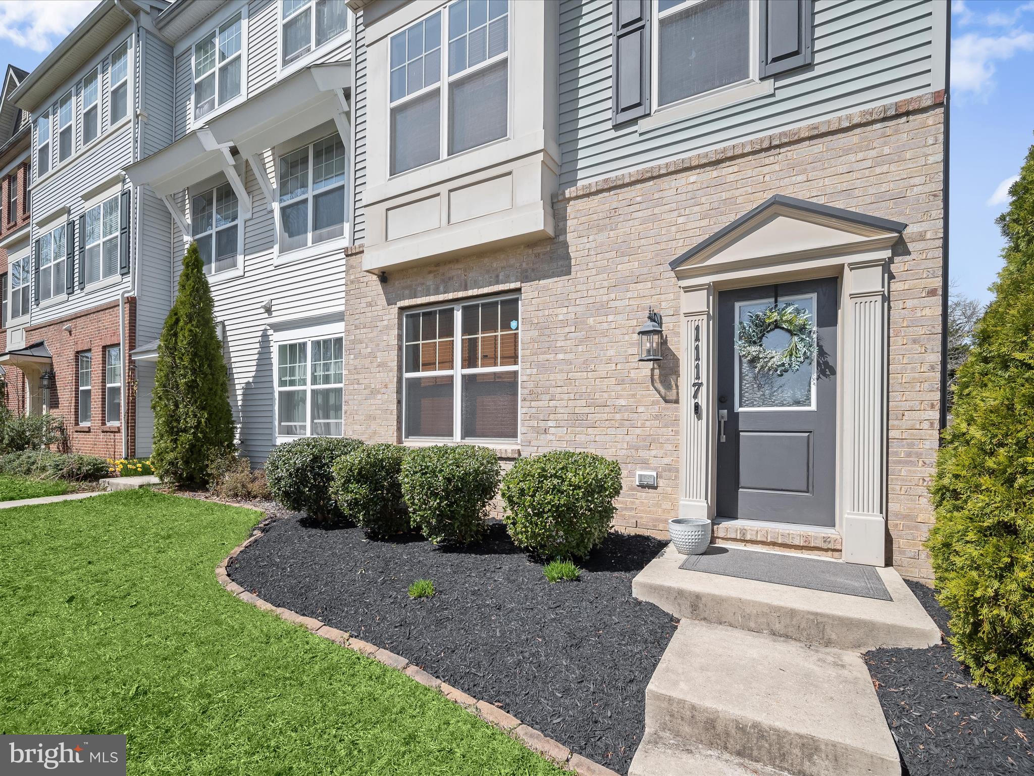 1117 Red Hawk Way Severn, MD 21144 - Photo 3 of 39 front view of a brick house with a yard