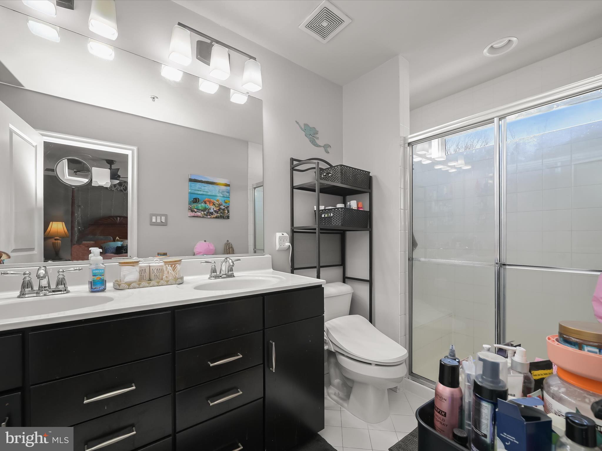 1117 Red Hawk Way Severn, MD 21144 - Photo 31 of 39 a bathroom with a double vanity sink toilet and shower