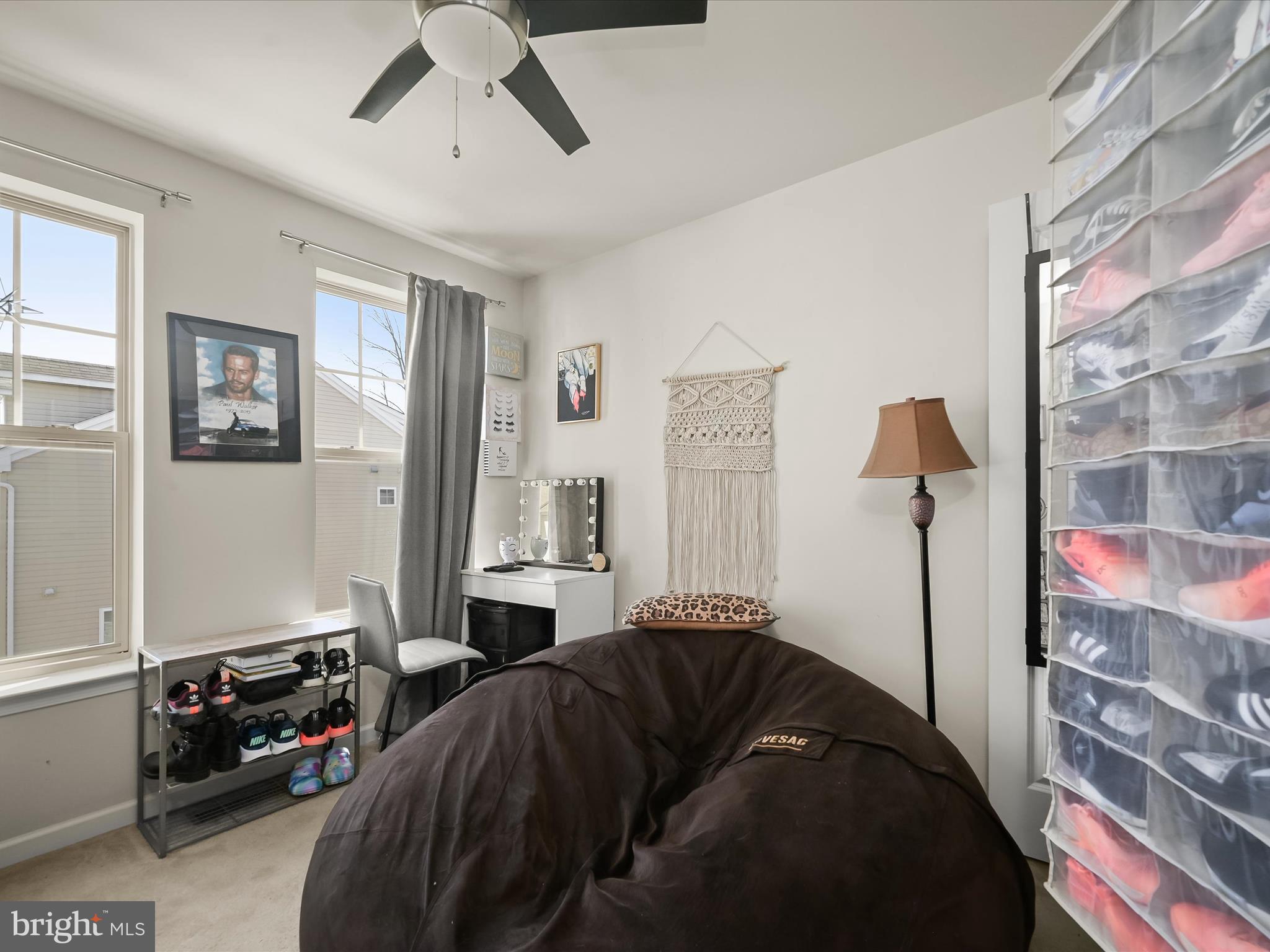 1117 Red Hawk Way Severn, MD 21144 - Photo 33 of 39 a bedroom with a bed and a chandelier