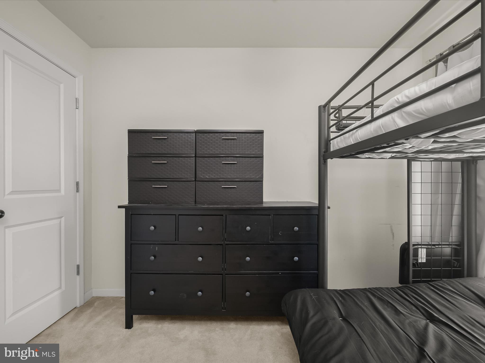 1117 Red Hawk Way Severn, MD 21144 - Photo 36 of 39 a bedroom with a bed and a dresser