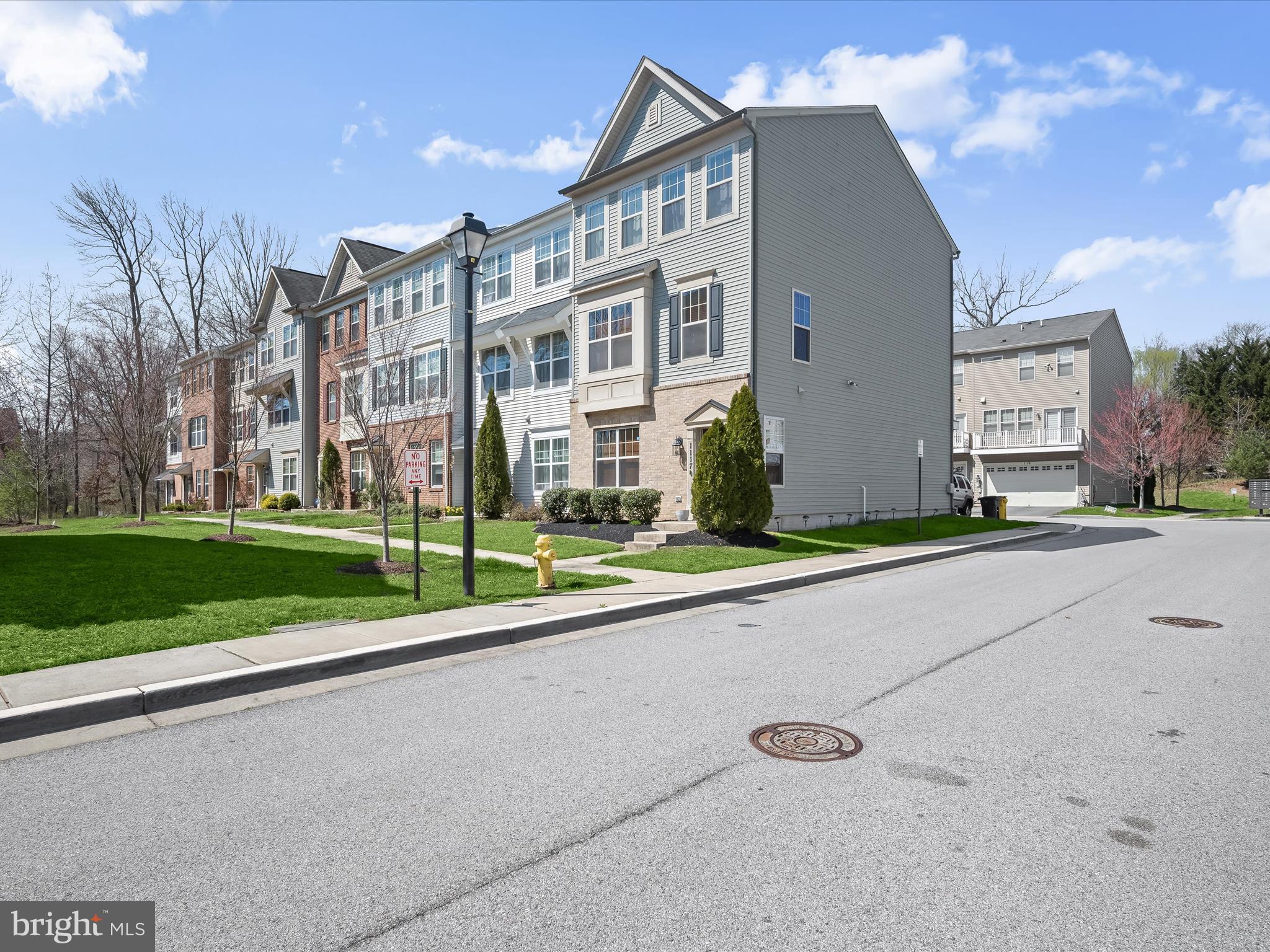 1117 Red Hawk Way Severn, MD 21144 - Photo 4 of 39 a view of a street with a building and trees in the background