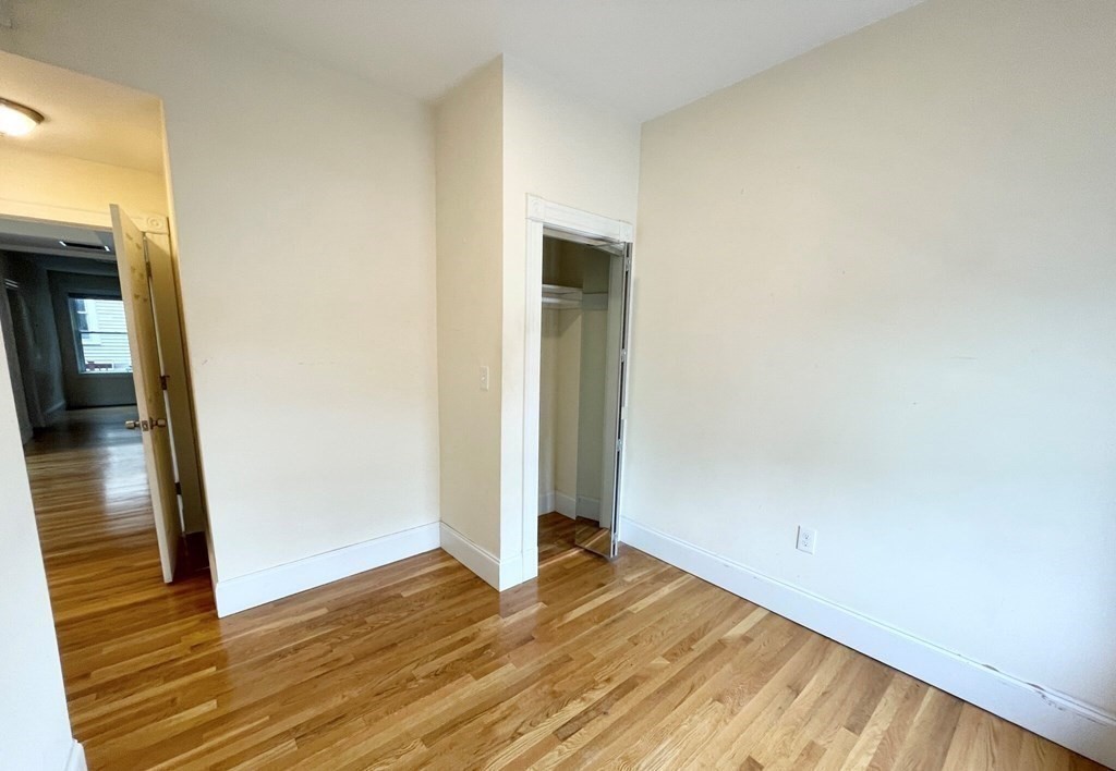 92 L Street, Unit 2 Boston, MA 02127 - Photo 6 of 15 a view of empty room with wooden floor