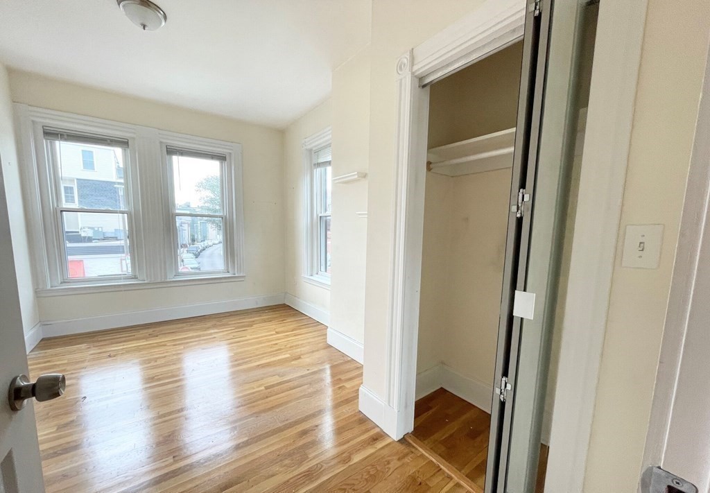 92 L Street, Unit 2 Boston, MA 02127 - Photo 9 of 15 a view of entryway with window and wooden floor