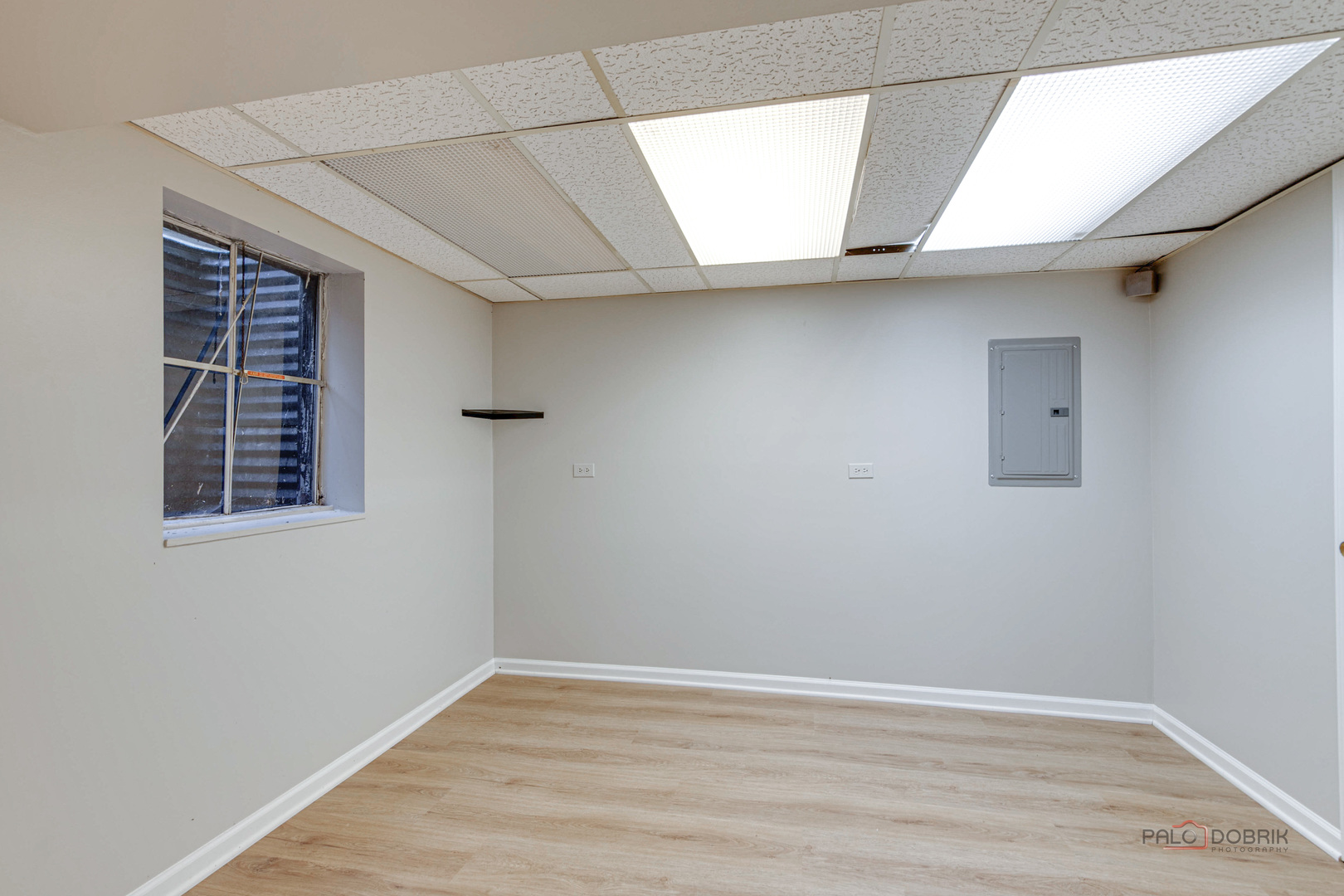 838 Inverrary Lane, Unit 838 Deerfield, IL 60015 - Photo 24 of 25 a view of an empty room with wooden floor and a window