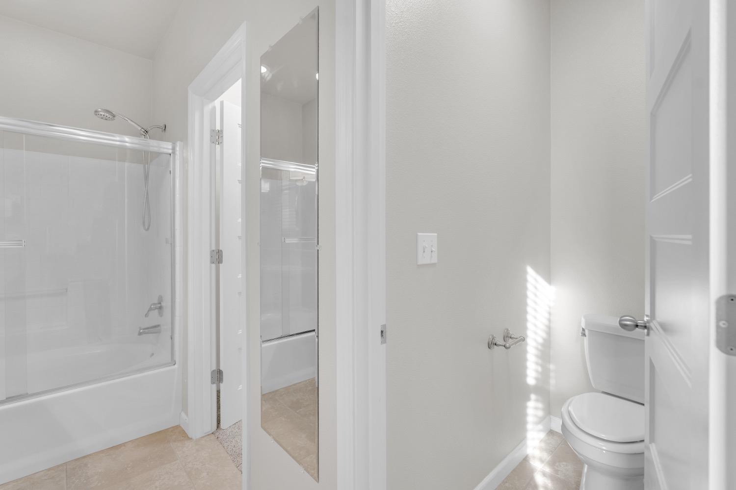 3532 Journey Way Clovis, CA 93619 - Photo 16 of 24 a bathroom with a granite countertop toilet a sink and shower