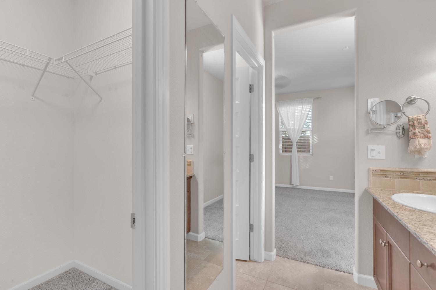 3532 Journey Way Clovis, CA 93619 - Photo 17 of 24 a view of a bathroom from the hallway
