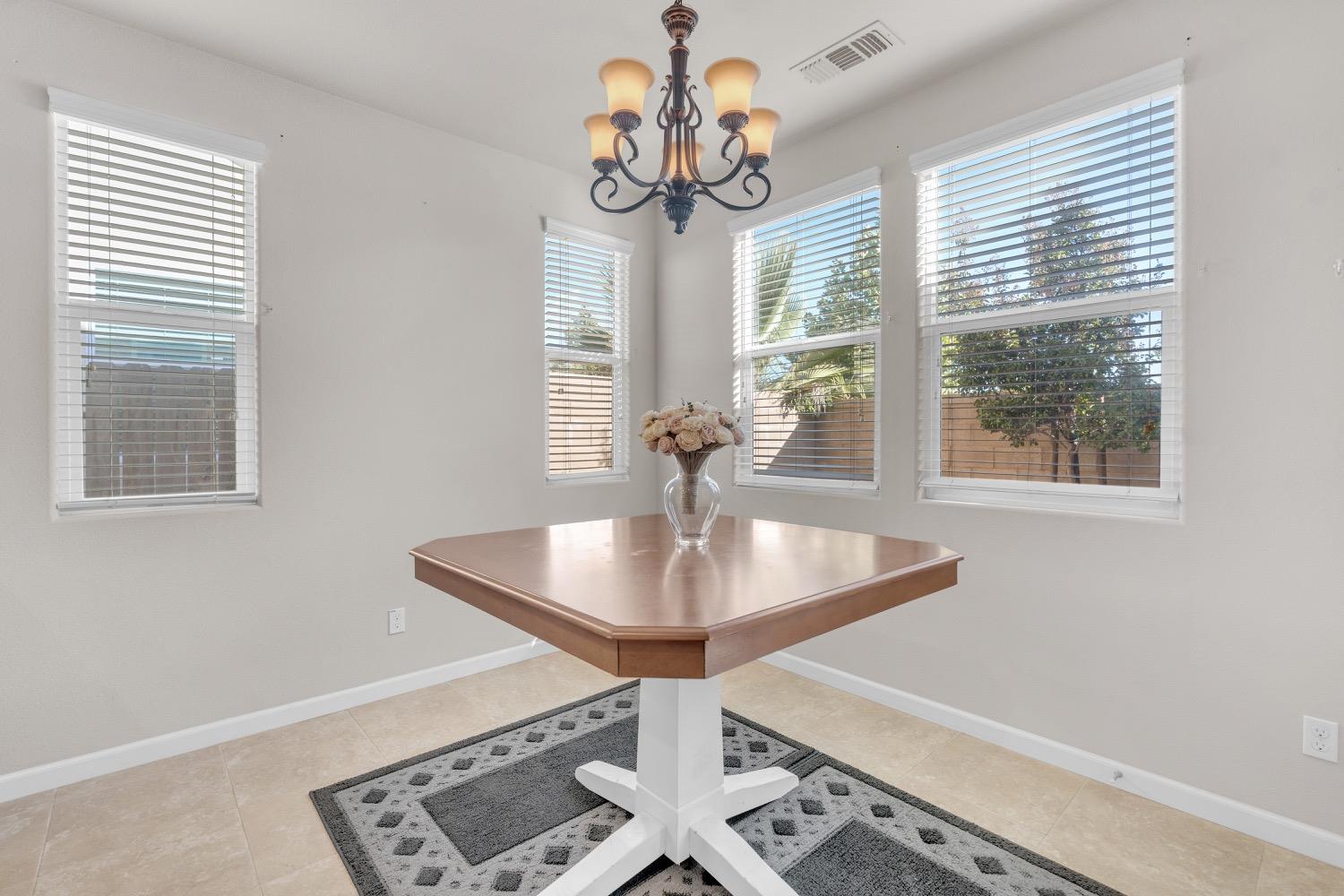 3532 Journey Way Clovis, CA 93619 - Photo 7 of 24 a dining room with table and chairs