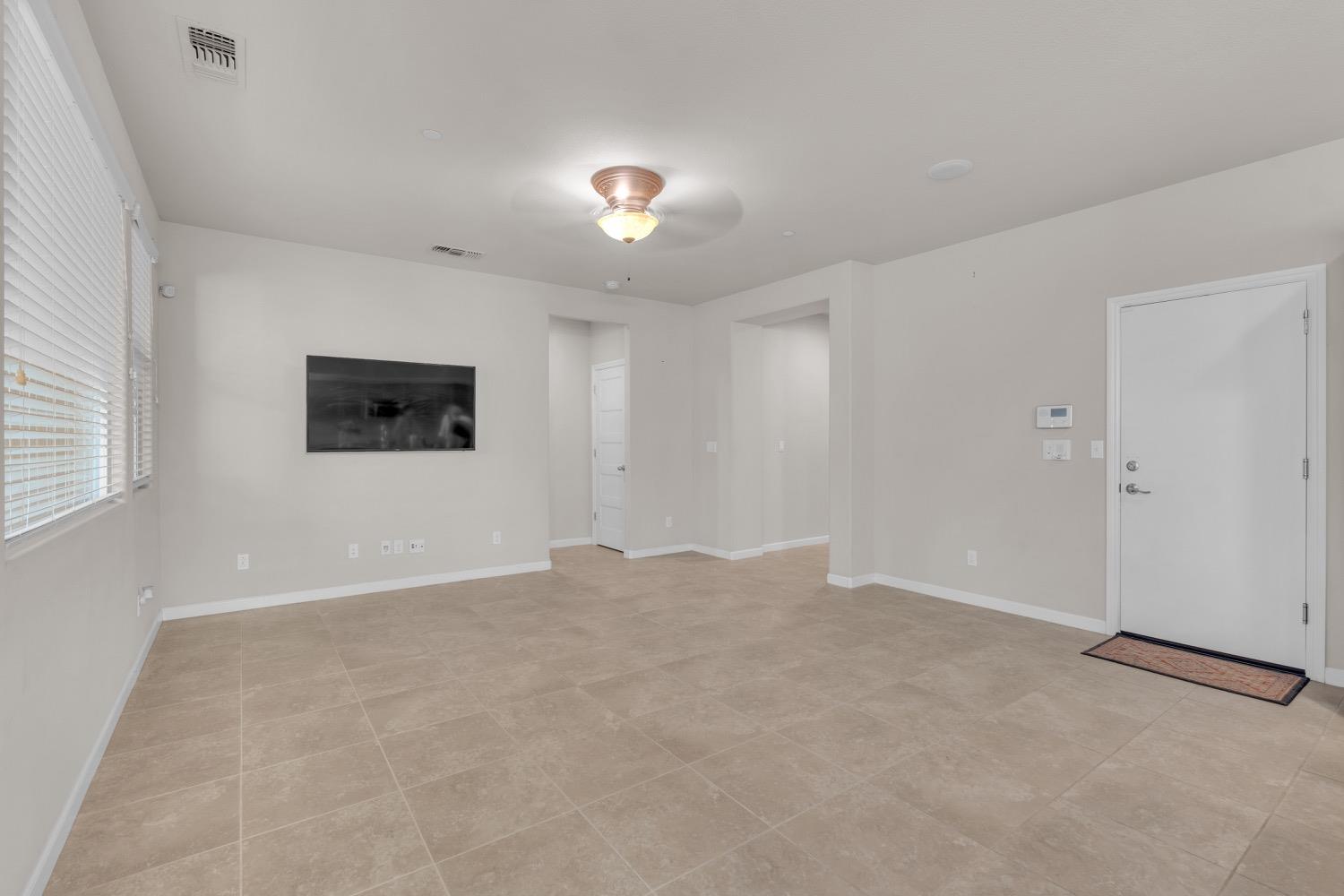 3532 Journey Way Clovis, CA 93619 - Photo 8 of 24 a view of an empty room with a window
