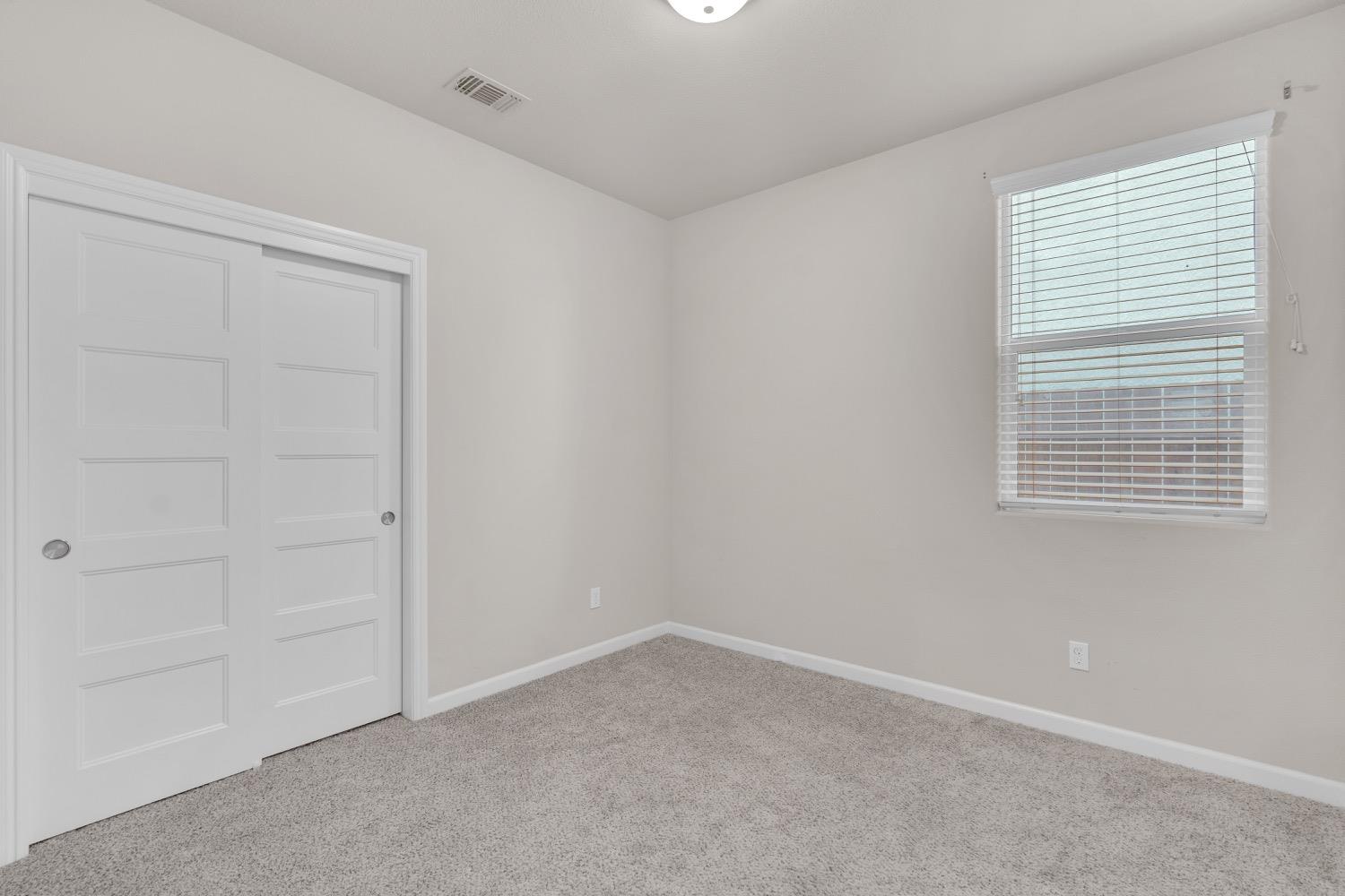 3532 Journey Way Clovis, CA 93619 - Photo 10 of 24 an empty room with windows