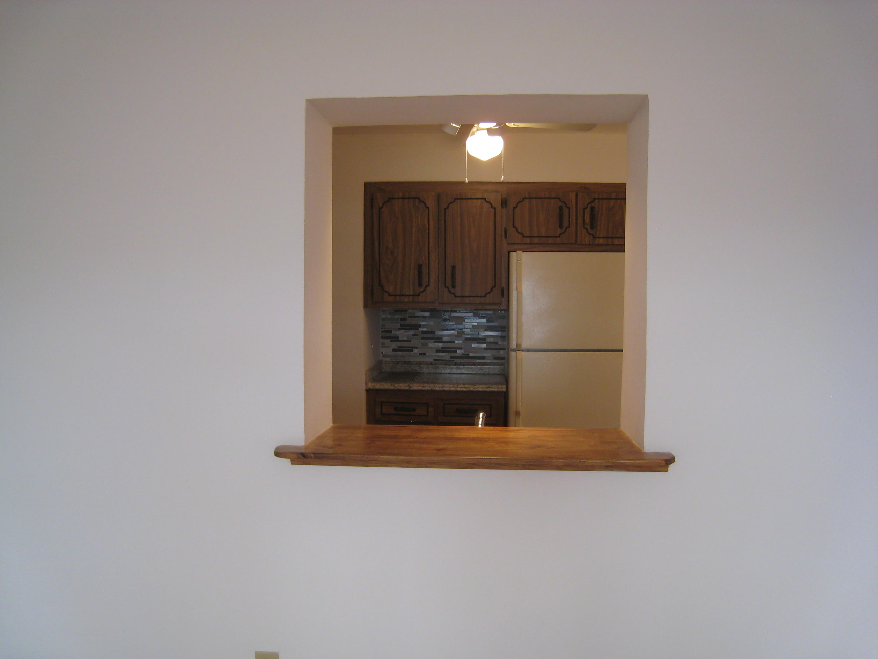 321 Masters Road Lake Worth, FL 33461 - Photo 11 of 21 Kitchen pass thru to Family room