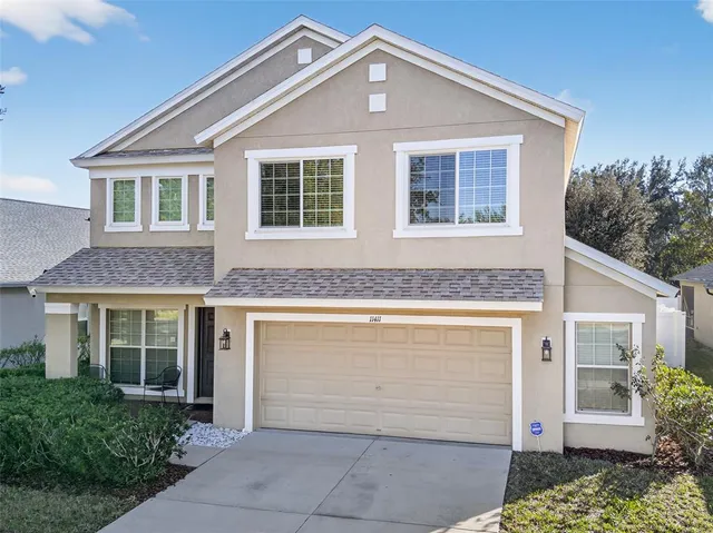 a front view of a house with a garage