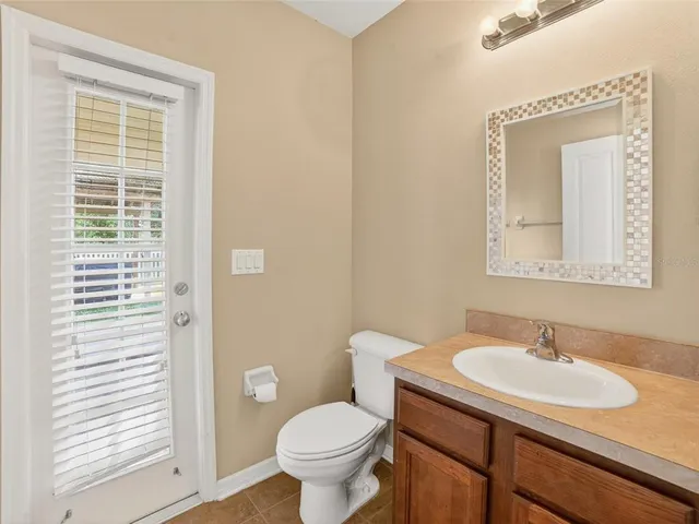 a bedroom with a bed and a fireplace